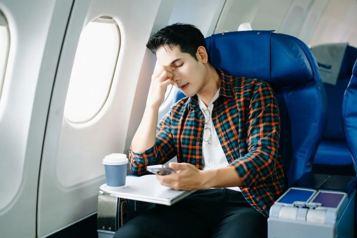 Tired passengers due to jet lag on a long flight